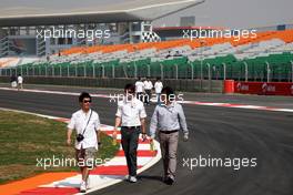 27.10.2011 New Delhi, India, Kamui Kobayashi (JAP), Sauber F1 Team walks the track - Formula 1 World Championship, Rd 17, Indian Grand Prix, Thursday
