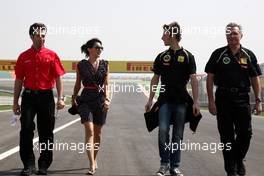 27.10.2011 New Delhi, India, Romain Grosjean (FRA) , Lotus Renault GP and his girlfriend Marion Joles (FRA) walks the track - Formula 1 World Championship, Rd 17, Indian Grand Prix, Thursday