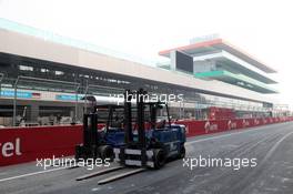 26.10.2011 New Delhi, India, Fork lift trucks on the start finish straight  - Formula 1 World Championship, Rd 17, Indian Grand Prix, Wednesday