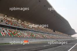 26.10.2011 New Delhi, India, The start finish straight and main grandstand  - Formula 1 World Championship, Rd 17, Indian Grand Prix, Wednesday