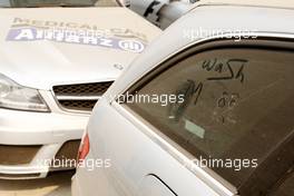 26.10.2011 New Delhi, India, Writing in dust on safety and medical cars - Formula 1 World Championship, Rd 17, Indian Grand Prix, Wednesday