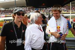 11.09.2011 Monza, Italy, Nicky Hayden Motor GP rider and Bernie Ecclestone (GBR) and Sebastian Vettel (GER), Red Bull Racing - Formula 1 World Championship, Rd 13, Italian Grand Prix, Sunday Pre-Race Grid