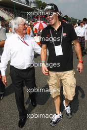 11.09.2011 Monza, Italy, Bernie Ecclestone (GBR) with Nicky Hayden (USA), MotoGP rider - Formula 1 World Championship, Rd 13, Italian Grand Prix, Sunday Pre-Race Grid