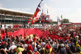 11.09.2011 Monza, Italy,  Fans on the track enjoy the podium - Formula 1 World Championship, Rd 13, Italian Grand Prix, Sunday Podium