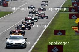 11.09.2011 Monza, Italy,  Safety car leads Fernando Alonso (ESP), Scuderia Ferrari, F150 - Formula 1 World Championship, Rd 13, Italian Grand Prix, Sunday Race