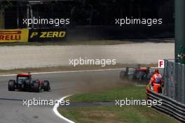 11.09.2011 Monza, Italy,  Michael Schumacher (GER), Mercedes GP Petronas F1 Team forces Lewis Hamilton (GBR), McLaren Mercedes onto the grass - Formula 1 World Championship, Rd 13, Italian Grand Prix, Sunday Race