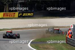 11.09.2011 Monza, Italy,  Michael Schumacher (GER), Mercedes GP Petronas F1 Team forces Lewis Hamilton (GBR), McLaren Mercedes onto the grass - Formula 1 World Championship, Rd 13, Italian Grand Prix, Sunday Race