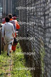 11.09.2011 Monza, Italy,  Sergio Pérez (MEX), Sauber F1 Team walks back after stopping on track - Formula 1 World Championship, Rd 13, Italian Grand Prix, Sunday Race