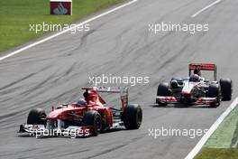 11.09.2011 Monza, Italy,  Fernando Alonso (ESP), Scuderia Ferrari, F150 leads Jenson Button (GBR), McLaren Mercedes, MP4-26 - Formula 1 World Championship, Rd 13, Italian Grand Prix, Sunday Race