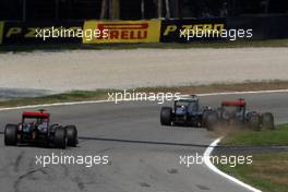 11.09.2011 Monza, Italy,  Michael Schumacher (GER), Mercedes GP Petronas F1 Team forces Lewis Hamilton (GBR), McLaren Mercedes onto the grass - Formula 1 World Championship, Rd 13, Italian Grand Prix, Sunday Race