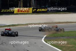 11.09.2011 Monza, Italy,  Michael Schumacher (GER), Mercedes GP Petronas F1 Team forces Lewis Hamilton (GBR), McLaren Mercedes onto the grass - Formula 1 World Championship, Rd 13, Italian Grand Prix, Sunday Race