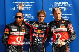 10.09.2011 Monza, Italy,  Lewis Hamilton (GBR), McLaren Mercedes, Sebastian Vettel (GER), Red Bull Racing in pole position, Jenson Button (GBR), McLaren Mercedes - Formula 1 World Championship, Rd 13, Italian Grand Prix, Saturday Qualifying