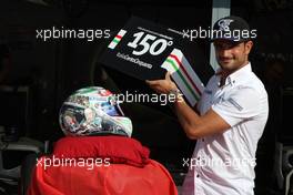 08.09.2011 Monza, Italy,  Vitantonio Liuzzi (ITA), HRT Formula One Team, shows his special new helmet for this Italian Grand Prix - Formula 1 World Championship, Rd 13, Italian Grand Prix, Thursday