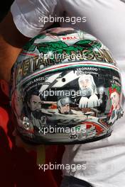 08.09.2011 Monza, Italy,  Vitantonio Liuzzi (ITA), HRT Formula One Team, shows his special new helmet for this Italian Grand Prix - Formula 1 World Championship, Rd 13, Italian Grand Prix, Thursday