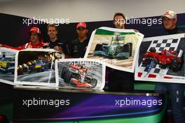 07.10.2011 Suzuka, Japan, The 5 world champions with signed photos commissioned by Bernie Ecclestone (GBR) to then be put up for auction to raise money for the Japanese disaster, Fernando Alonso (ESP), Scuderia Ferrari with Sebastian Vettel (GER), Red Bull Racing, Lewis Hamilton (GBR), McLaren Mercedes and Michael Schumacher (GER), Mercedes GP Petronas F1 Team  - Formula 1 World Championship, Rd 15, Japanese Grand Prix, Friday Practice