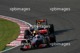 09.10.2011 Suzuka, Japan,  Sebastian Vettel (GER), Red Bull Racing and Jenson Button (GBR), McLaren Mercedes  - Formula 1 World Championship, Rd 15, Japanese Grand Prix, Sunday Race
