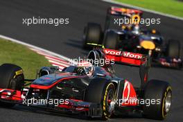 09.10.2011 Suzuka, Japan, Jenson Button (GBR), McLaren Mercedes leads Sebastian Vettel (GER), Red Bull Racing  - Formula 1 World Championship, Rd 15, Japanese Grand Prix, Sunday Race