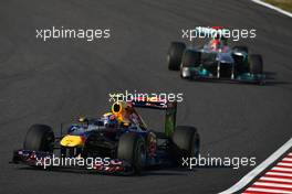 09.10.2011 Suzuka, Japan, Mark Webber (AUS), Red Bull Racing leads Michael Schumacher (GER), Mercedes GP Petronas F1 Team  - Formula 1 World Championship, Rd 15, Japanese Grand Prix, Sunday Race