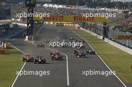 09.10.2011 Suzuka, Japan, Sebastian Vettel (GER), Red Bull Racing leads the start of the race and leads Jenson Button (GBR), McLaren Mercedes  - Formula 1 World Championship, Rd 15, Japanese Grand Prix, Sunday Race