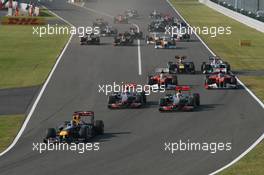 09.10.2011 Suzuka, Japan, Sebastian Vettel (GER), Red Bull Racing leads the start of the race and leads Jenson Button (GBR), McLaren Mercedes  - Formula 1 World Championship, Rd 15, Japanese Grand Prix, Sunday Race