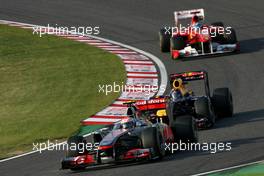 09.10.2011 Suzuka, Japan,  Jenson Button (GBR), McLaren Mercedes and Sebastian Vettel (GER), Red Bull Racing  - Formula 1 World Championship, Rd 15, Japanese Grand Prix, Sunday Race