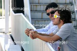 06.10.2011 Suzuka, Japan,  Fernando Alonso (ESP), Scuderia Ferrari with his manager - Formula 1 World Championship, Rd 15, Japanese Grand Prix, Thursday