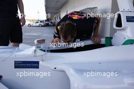 06.10.2011 Suzuka, Japan, Sebastian Vettel (GER), Red Bull Racing checking out the FIA f1 cockpit  - Formula 1 World Championship, Rd 15, Japanese Grand Prix, Thursday