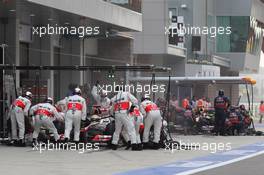 16.10.2011 Yeongam, Korea, Lewis Hamilton (GBR), McLaren Mercedes and Mark Webber (AUS), Red Bull Racing pit stop  - Formula 1 World Championship, Rd 16, Korean Grand Prix, Sunday Pre-Race Grid