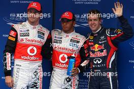 15.10.2011 Yeongam, Korea, Jenson Button (GBR), McLaren Mercedes with Lewis Hamilton (GBR), McLaren Mercedes and Sebastian Vettel (GER), Red Bull Racing  - Formula 1 World Championship, Rd 16, Korean Grand Prix, Saturday Qualifying