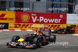 29.05.2011 Monte Carlo, Monaco,  Sebastian Vettel (GER), Red Bull Racing leads Nick Heidfeld (GER), Lotus Renault GP - Formula 1 World Championship, Rd 06, Monaco Grand Prix, Sunday Race