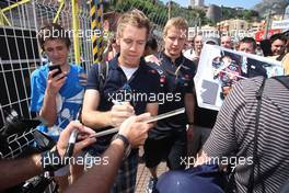 25.05.2011 Monaco, Monte Carlo, Sebastian Vettel (GER), Red Bull Racing signing autographs for the fans - Formula 1 World Championship, Rd 6, Monaco Grand Prix, Wednesday