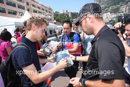 25.05.2011 Monaco, Monte Carlo, Sebastian Vettel (GER), Red Bull Racing is signing autographs for the fans - Formula 1 World Championship, Rd 6, Monaco Grand Prix, Wednesday