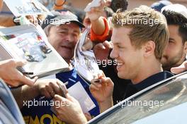 25.05.2011 Monaco, Monte Carlo, Sebastian Vettel (GER), Red Bull Racing signing autographs for the fans - Formula 1 World Championship, Rd 6, Monaco Grand Prix, Wednesday