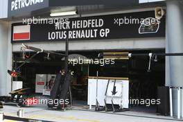08.04.2011 Sepang, Malaysia,  Nick Heidfeld (GER), Lotus Renault GP garage still with a Polish flag  - Formula 1 World Championship, Rd 02, Malaysian Grand Prix, Friday Practice