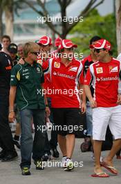 08.04.2011 Sepang, Malaysia,  Heikki Kovalainen (FIN), Team Lotus with Fernando Alonso (ESP), Scuderia Ferrari and Felipe Massa (BRA), Scuderia Ferrari - Formula 1 World Championship, Rd 02, Malaysian Grand Prix, Friday