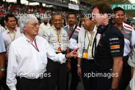 10.04.2011 Sepang, Malaysia,  Bernie Ecclestone (GBR) with Christian Horner (GBR), Red Bull Racing, Sporting Director - Formula 1 World Championship, Rd 02, Malaysian Grand Prix, Sunday Pre-Race Grid