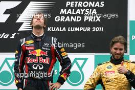10.04.2011 Sepang, Malaysia,  Sebastian Vettel (GER), Red Bull Racing and Nick Heidfeld (GER), Lotus Renault F1 Team  - Formula 1 World Championship, Rd 02, Malaysian Grand Prix, Sunday Podium