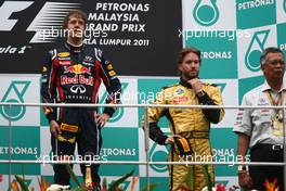 10.04.2011 Sepang, Malaysia,  Sebastian Vettel (GER), Red Bull Racing and Nick Heidfeld (GER), Lotus Renault GP - Formula 1 World Championship, Rd 02, Malaysian Grand Prix, Sunday Podium
