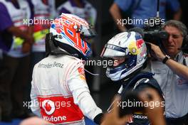 10.04.2011 Sepang, Malaysia,  Jenson Button (GBR), McLaren Mercedes and Sebastian Vettel (GER), Red Bull Racing - Formula 1 World Championship, Rd 02, Malaysian Grand Prix, Sunday Podium