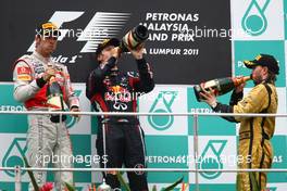 10.04.2011 Sepang, Malaysia,  2nd place Jenson Button (GBR), McLaren Mercedes, 1st place Sebastian Vettel (GER), Red Bull Racing and 3rd place Nick Heidfeld (GER), Lotus Renault GP - Formula 1 World Championship, Rd 02, Malaysian Grand Prix, Sunday Podium