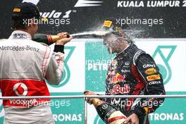 10.04.2011 Sepang, Malaysia,  Jenson Button (GBR), McLaren Mercedes and Sebastian Vettel (GER), Red Bull Racing  - Formula 1 World Championship, Rd 02, Malaysian Grand Prix, Sunday Podium