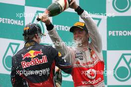 10.04.2011 Sepang, Malaysia,  Sebastian Vettel (GER), Red Bull Racing and Jenson Button (GBR), McLaren Mercedes  - Formula 1 World Championship, Rd 02, Malaysian Grand Prix, Sunday Podium