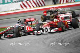 10.04.2011 Sepang, Malaysia,  Jenson Button (GBR), McLaren Mercedes and Fernando Alonso (ESP), Scuderia Ferrari - Formula 1 World Championship, Rd 02, Malaysian Grand Prix, Sunday Race