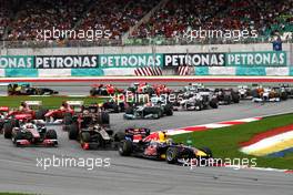 10.04.2011 Sepang, Malaysia,  Sebastian Vettel (GER), Red Bull Racing leads the start of the race - Formula 1 World Championship, Rd 02, Malaysian Grand Prix, Sunday Race