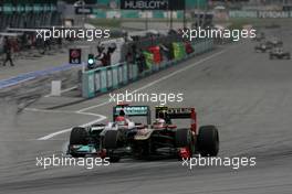 10.04.2011 Sepang, Malaysia,  Vitaly Petrov (RUS), Lotus Renalut F1 Team and Nico Rosberg (GER), Mercedes GP  - Formula 1 World Championship, Rd 02, Malaysian Grand Prix, Sunday Race