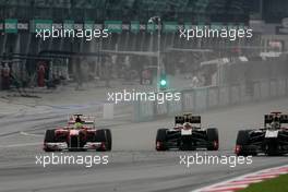 10.04.2011 Sepang, Malaysia,  Felipe Massa (BRA), Scuderia Ferrari and Vitaly Petrov (RUS), Lotus Renalut F1 Team  - Formula 1 World Championship, Rd 02, Malaysian Grand Prix, Sunday Race