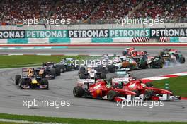 10.04.2011 Sepang, Malaysia,  Felipe Massa (BRA), Scuderia Ferrari and Fernando Alonso (ESP), Scuderia Ferrari at the start of the race - Formula 1 World Championship, Rd 02, Malaysian Grand Prix, Sunday Race