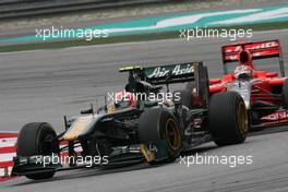 10.04.2011 Sepang, Malaysia,  Jarno Trulli (ITA), Team Lotus and Timo Glock (GER), Virgin Racing  - Formula 1 World Championship, Rd 02, Malaysian Grand Prix, Sunday Race