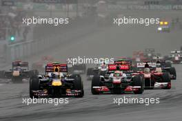 10.04.2011 Sepang, Malaysia,  Start of the race, Lewis Hamilton (GBR), McLaren Mercedes and Sebastian Vettel (GER), Red Bull Racing  - Formula 1 World Championship, Rd 02, Malaysian Grand Prix, Sunday Race