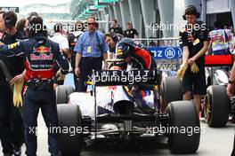 09.04.2011 Sepang, Malaysia,  FIA talking with the mechanics Red Bull over the car of Sebastian Vettel (GER), Red Bull Racing - Formula 1 World Championship, Rd 02, Malaysian Grand Prix, Saturday Qualifying